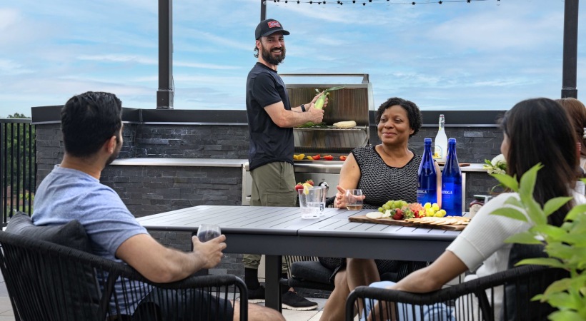 Roof deck terrace with fire pit, grilling and lounging spaces