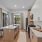 Furnished kitchen with a quartz countertop and Large Kitchen Island with natural lighting from windows 