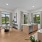 Large Living Room with Tall Ceilings, Oversized Windows with a center kitchen island on hardwood-style flooring